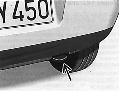 To tow the vehicle, first remove the right grille at the bottom of the front bumper and screw in…