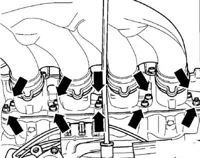12. Unscrew the nuts (indicated by arrows), securing the top of the intake pipe to the bracket…