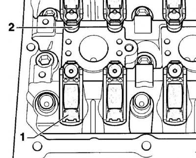 5. Apply a thin layer of AMV 188 003 sealant to the mating surface of the camshaft housing.