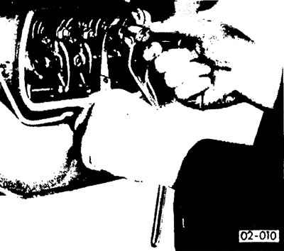 Insert a 0.15 mm feeler gauge between the valve rocker arm and its stem. If the valve clearance is…