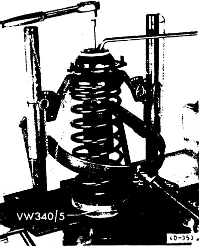 Compress the shock absorber spring using a special tool and unscrew the hex nut on the piston rod,…