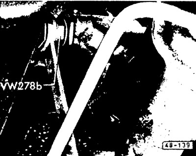 Turn the steering shaft at the steering gear connection while tightening the adjusting bolt until…