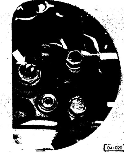 The adjusting bolt can be accessed through a hole in the trunk lid.