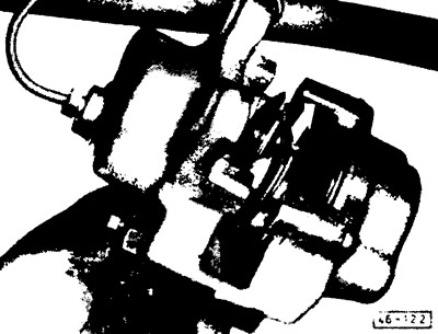 Move the noise-damping shields toward the middle of the caliper and remove them.