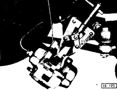 Press the caliper pistons back using a special tool for returning the pistons or a strong wooden…