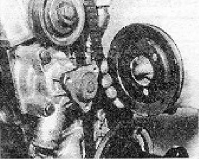 Photo 8.7. Removing the water pump pulley.