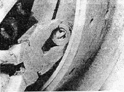 Photo 7.8. Removing the brake shoe stability spring seat.