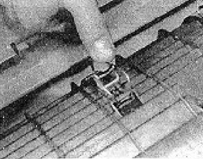 Photo 6B.5. Release the air cleaner cover clamps.