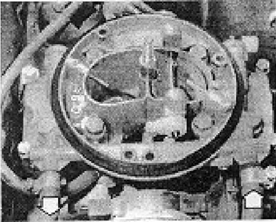 Photo 6B.13. Inlet and outlet fuel hoses on a 2B6 carburetor (shown by arrows).