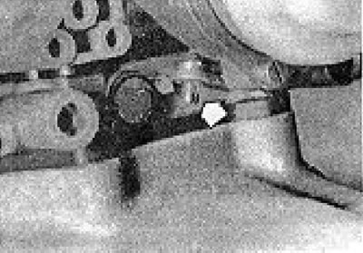 Photo 6B.22. Fast idle speed adjustment pin (shown by the arrow) on a 2B6 carburetor.