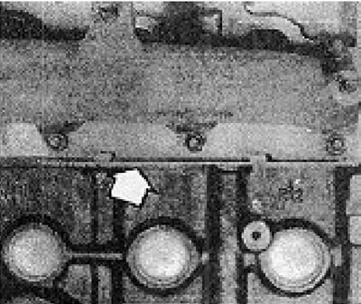 Photo 6B.85A. Lower front manifold shield (shown by the arrow)...