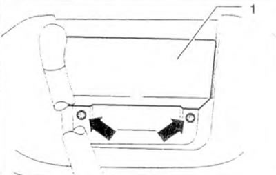 Figure 10.45. Remove the screws (arrows) under the ashtray 1.