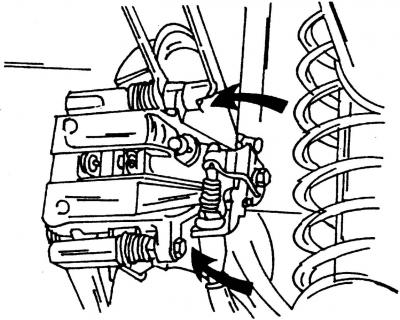 Рис. 322. Места расположения болтов крепления суппорта показаны стрелками